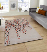 Modern geometric wool rug featuring burnt orange and brown motifs